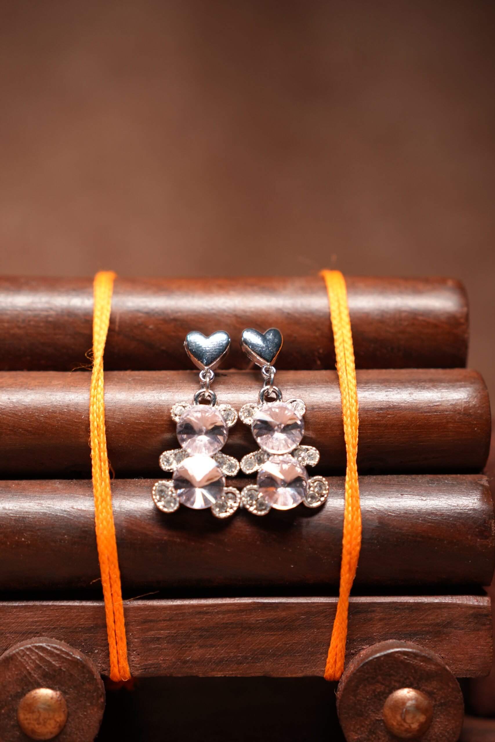 Silver heart stud crystal bear drop earrings with sparkling rhinestone pendant on wooden jewellery stand – D2Dazzle fashion jewellery
