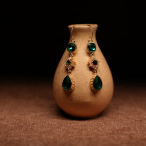 Emerald green crystal teardrop drop earrings with gold starburst connector — D2Dazzle