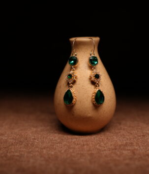 Emerald green crystal teardrop drop earrings with gold starburst connector — D2Dazzle