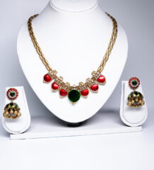 kundan meenakari necklace set with red and green stones and matching jhumka earrings