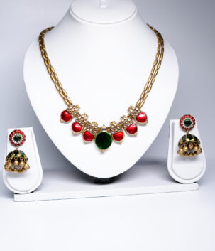 kundan meenakari necklace set with red and green stones and matching jhumka earrings