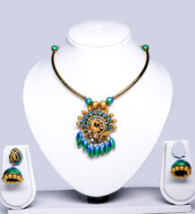peacock choker necklace with blue-green enamel drops and matching jhumka earrings displayed on a white jewellery bust.
