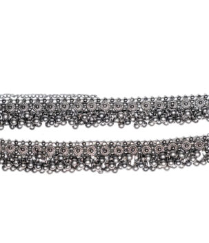 Pair of oxidised anklets with floral discs, hanging ghungroo-style beads and an adjustable hook clasp chain, shown on a white background.